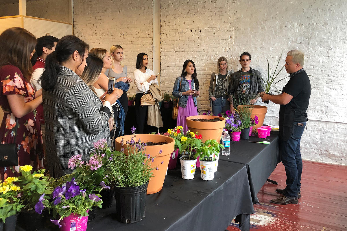 social media event demonstrating container planting to influencers